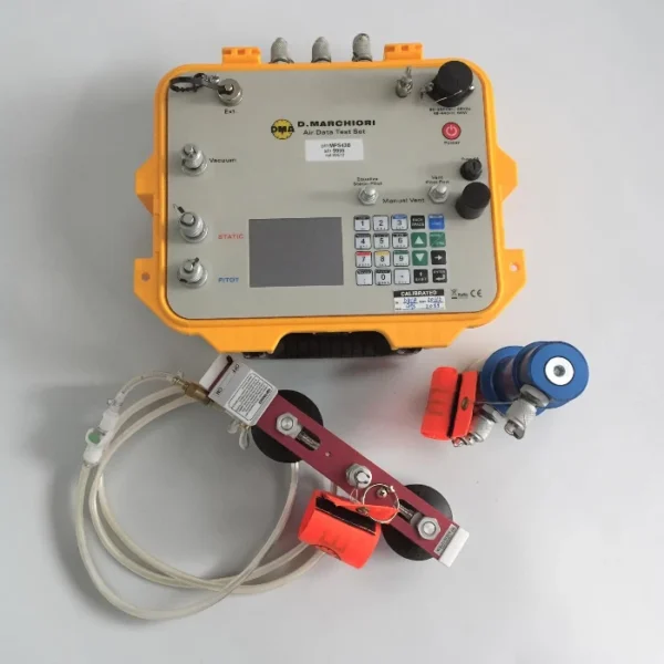 Top-down view of a DMA-Aero MPS43 (D. Marchiori) Air Data Test Set housed in a rugged orange enclosure, displayed alongside its pitot-static hose assembly and adapter coupling accessories on a plain white background.