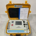 An open yellow rugged case displaying the Barfield DPS1000 Imperium Series Digital Pitot Static Test Set panel, featuring a central digital display screen, pneumatic ports, and its official certificate of calibration documentation.