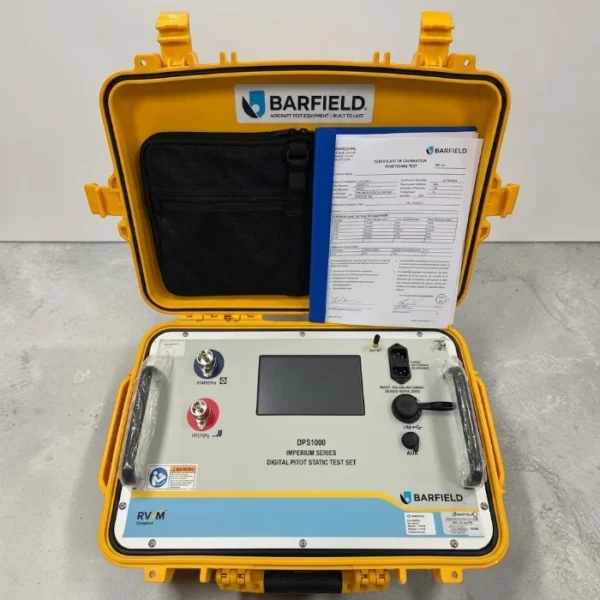 An open yellow rugged case displaying the Barfield DPS1000 Imperium Series Digital Pitot Static Test Set panel, featuring a central digital display screen, pneumatic ports, and its official certificate of calibration documentation.