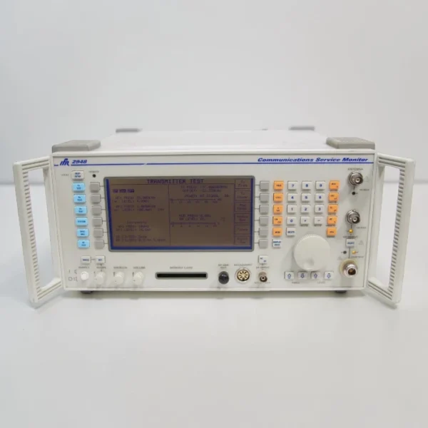 A straight-on front view of the Aeroflex IFR 2948 Communications Service Monitor with its screen illuminated showing a Transmitter Test menu interface.
