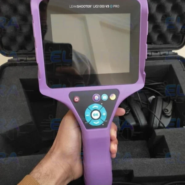 A hand holds a purple Synergys LeakShooter LKS1000-V3+ PRO ultrasonic leak detection camera in front of an open, foam-lined hard carrying case containing headphones and other accessories.