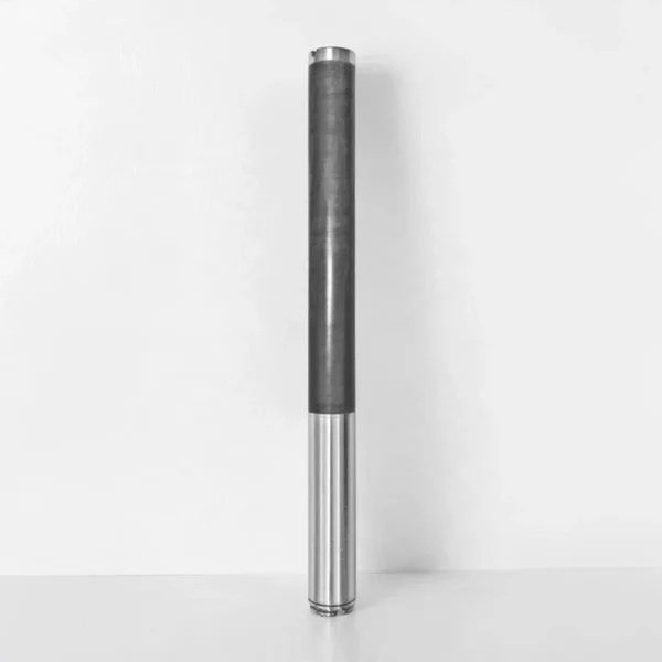 Refurbished DigiTrak FX 12 transmitter sonde for HDD rigs, stood vertically against a light gray wall